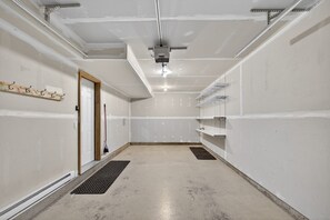 A room with a door, a shelf, and a vent on the ceiling. - 3 BDR Townhouse / Pet friendly / Great Location (Invermere)