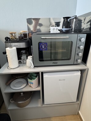 Mini-fridge, high chair, cookware/dishes/utensils