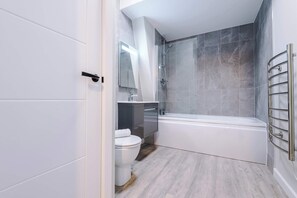 Shower, hair dryer, towels, shampoo