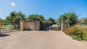 A gated entrance with a sign reading "ROSA LEDA". - Villa La Rosaleda - By Dream Villas Pollensa (Pollensa)