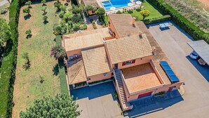 An aerial view of a property with a swimming pool, a tennis court, and a landscaped garden. - Villa La Rosaleda - By Dream Villas Pollensa (Pollensa)