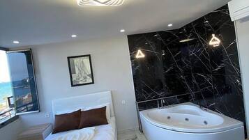 Comfort Quadruple Room, Balcony, Beach View | Bathroom | Shower, free toiletries, hair dryer, towels