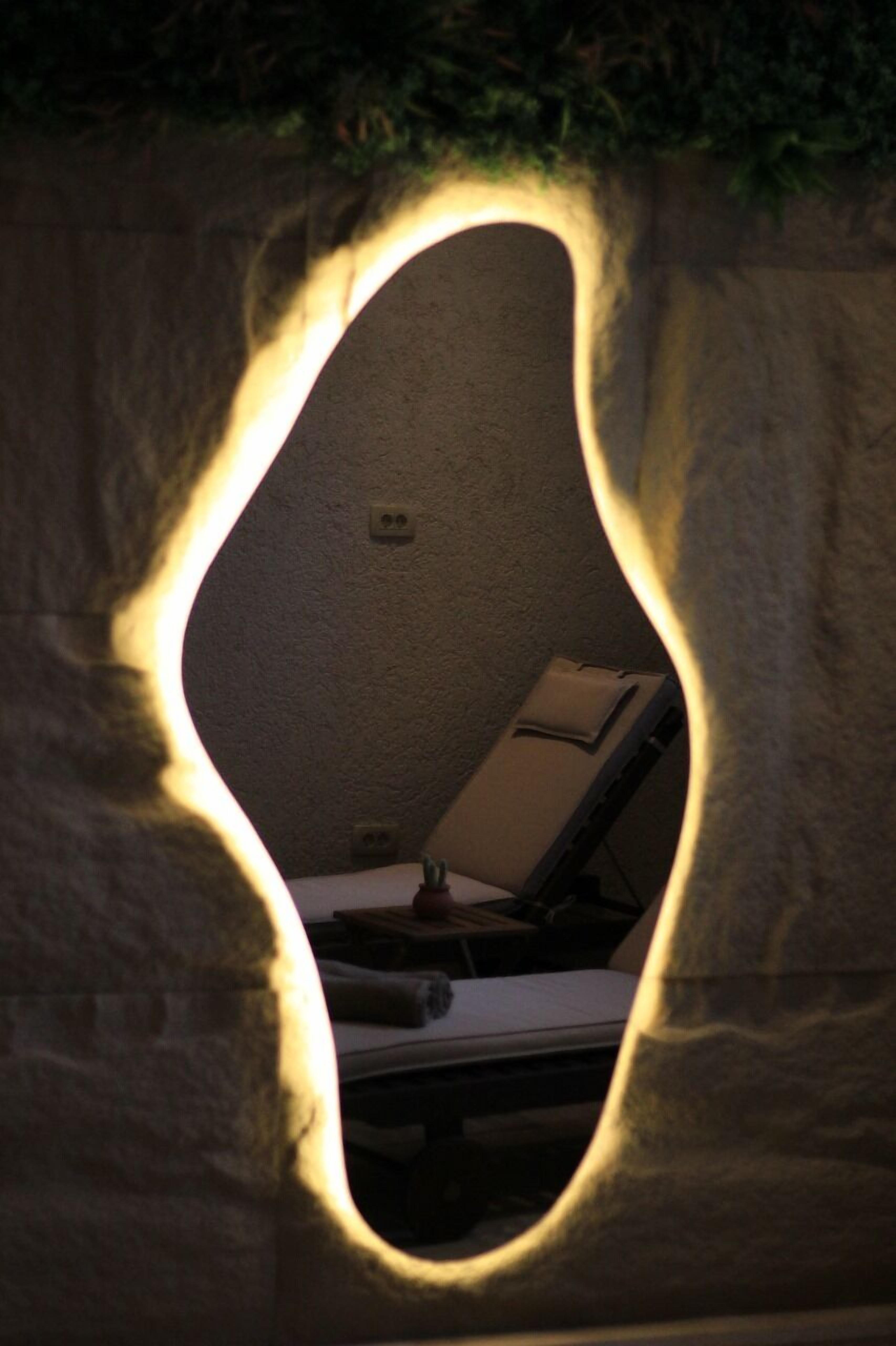 A room with a bed, a desk, and a chair.