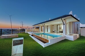 A modern house with a swimming pool, a patio, and a view of the sea. - The Fern Sattva Resort Little Rann of Kutch, Series by Marriott (Dasada)