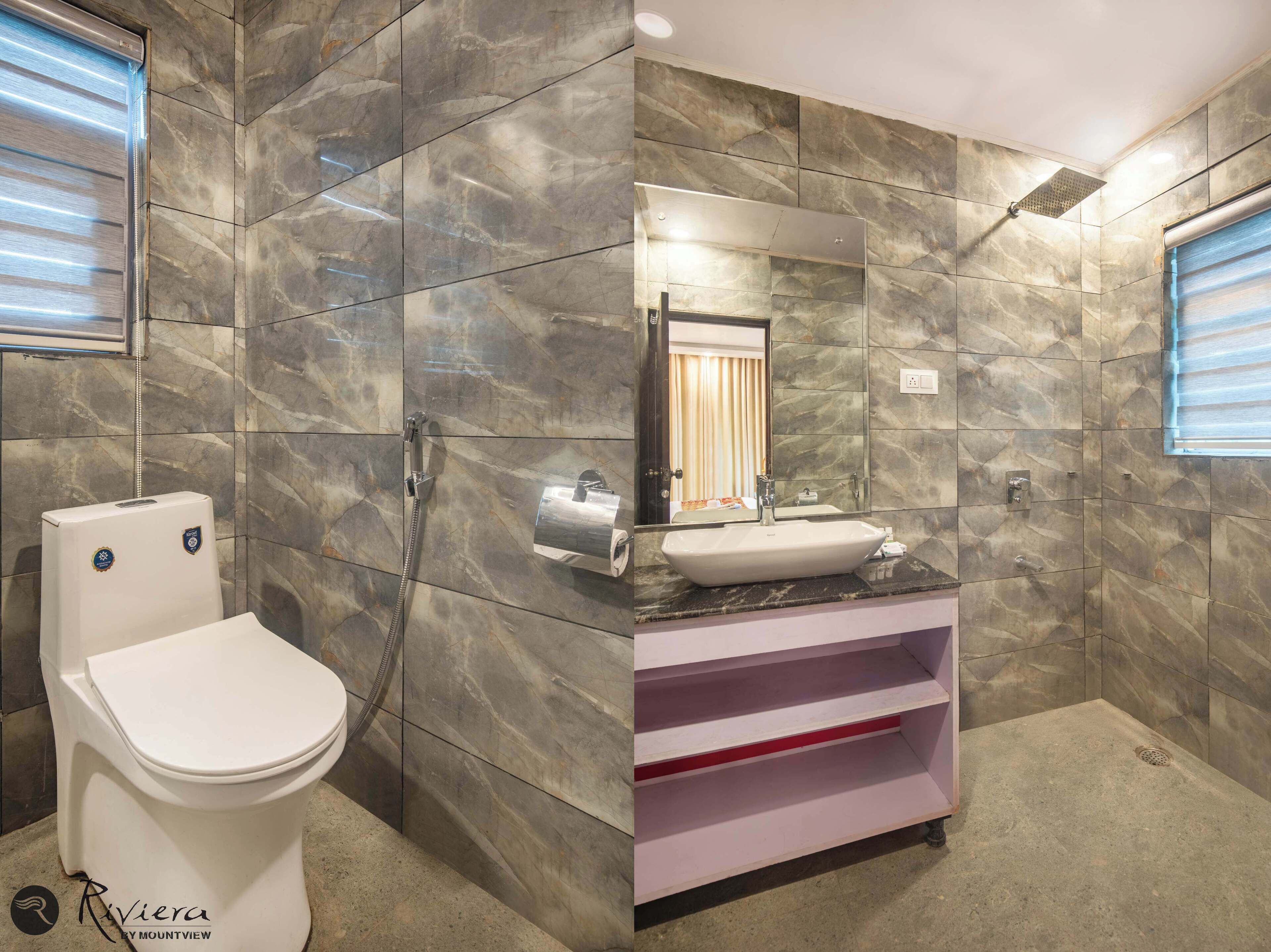 Un baño con inodoro, lavabo y ducha.