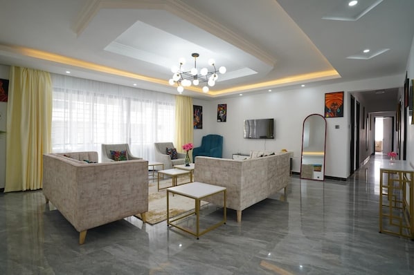 Family Apartment, City View | Living area | 24-inch Smart TV with digital channels - Lux Suites Platinum Oak Residency (Nairobi)