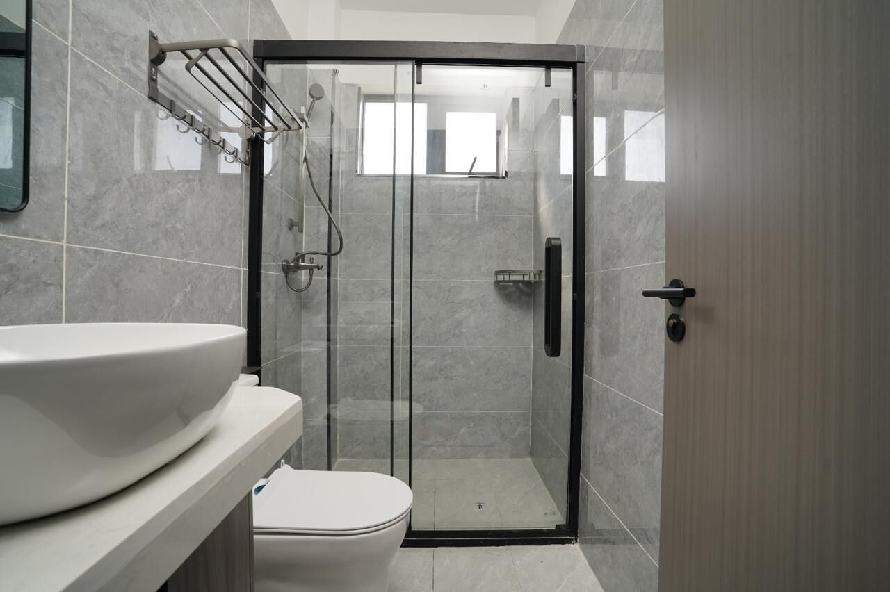 Family Apartment, City View | Bathroom | Shower, free toiletries, slippers, towels