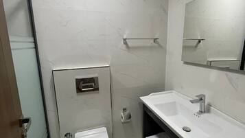 Family Triple Room, Balcony | Bathroom | Shower, hair dryer, towels, soap