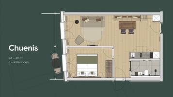 Plan d’aménagement d’une pièce de 44 à 49 m², conçue pour accueillir de deux à quatre personnes, comprenant un lit, un coin salon et une kitchenette.
