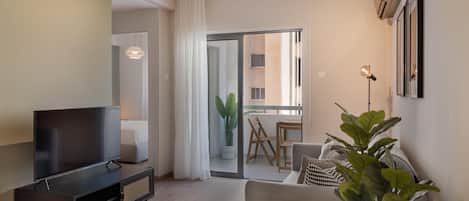 Luxury Apartment, City View | Living area | Flat-screen TV