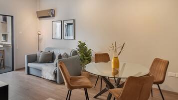 Luxury Apartment, City View | Living area | Flat-screen TV