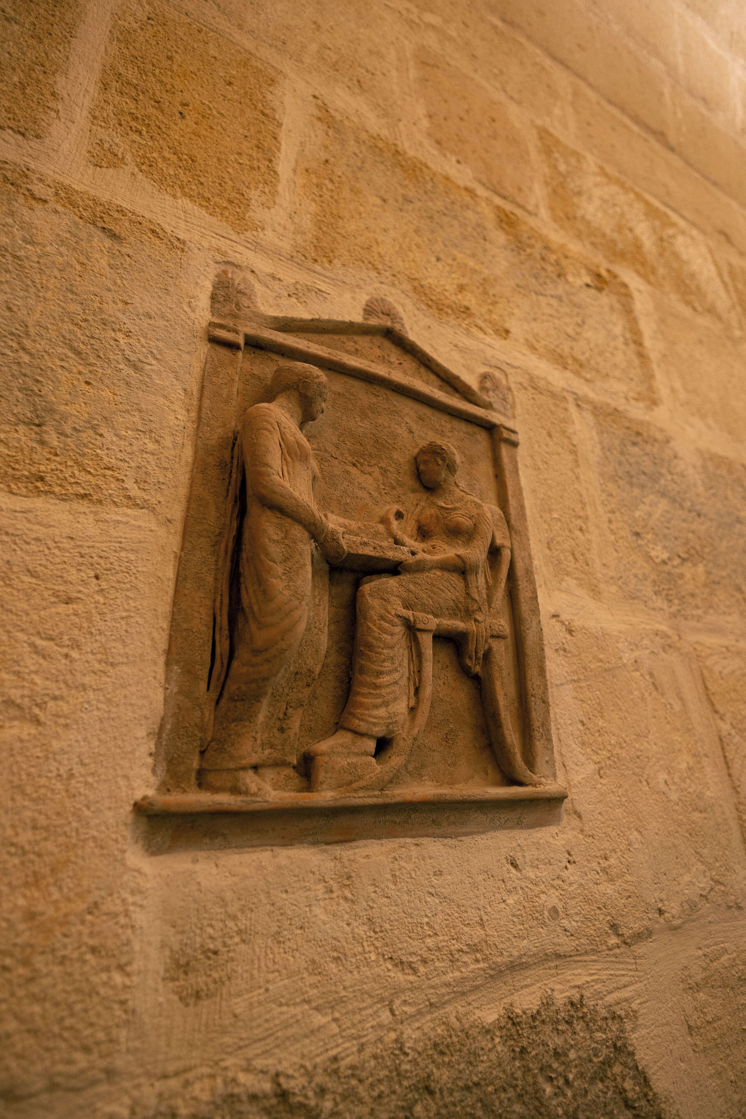 A stone relief sculpture on a wall.