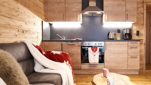 A cozy living room with a sofa, a coffee table, and a fireplace. - Apartment in Leutasch Near Ski Trails (Leutasch)