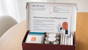 A box with a welcome note, French coffee pods, Sri Lankan tea, and a deck of playing cards.
