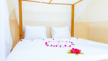 Economy Double Room, Ocean View | In-room safe, iron/ironing board, bed sheets