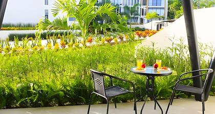 2BR Ground Floor + Balcony • Pool • Beach 15 min away