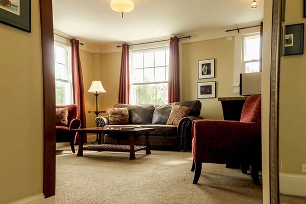 Lounge together in a bright corner living space with cozy textures.