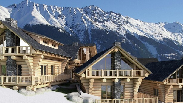 A log cabin resort with multiple buildings, wooden balconies, and a snowy mountain backdrop. - Chalet in Ladis by Ski Slope & Sonnenbahn (Ladis)