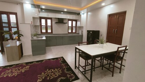 A two-bedroom home with a living room, kitchen, and garden feels like home.
