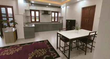 A two-bedroom home with a living room, kitchen, and garden feels like home.