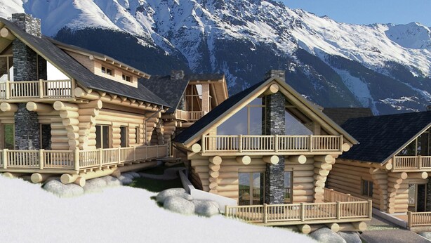 Ein Hotel im Blockhausstil mit mehreren Gebäuden, Steinverzierungen und einem verschneiten Berg im Hintergrund.