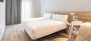 Double Room | Minibar, in-room safe, desk, blackout drapes
