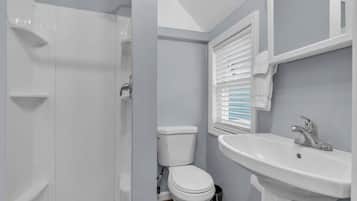 Shower, hair dryer, towels, shampoo