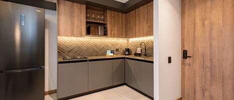 Fridge, microwave, stovetop, coffee/tea maker