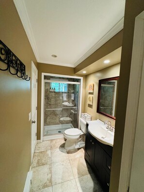 Shower, hair dryer, towels, soap