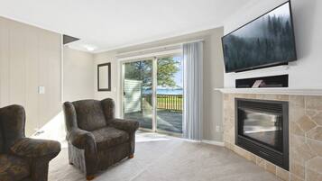 Family Townhome, Lake View | Living area | 35-inch flat-screen TV with cable channels, fireplace