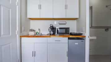 Fridge, microwave, coffee/tea maker, cookware/dishes/utensils