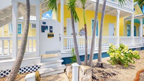 A yellow building with white railings and a sign that reads "Galleon." - Carey's Corner | Updated Studio with Heated Pool (Key West)