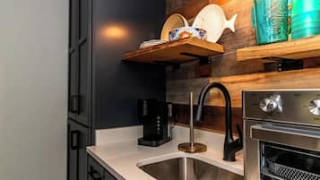 Fridge, oven, coffee/tea maker, cookware/dishes/utensils