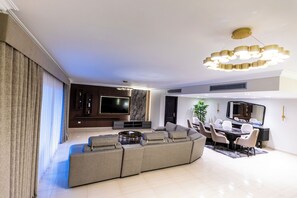 Family Apartment, 5 Bedrooms, Kitchen, Pool View | Living area | 75-inch flat-screen TV with digital channels, TV, Netflix