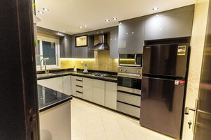 Family Apartment, 5 Bedrooms, Kitchen, Pool View | Private kitchen | Full-sized fridge, microwave, electric kettle, blender