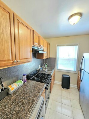 Fridge, microwave, oven, stovetop - Modern Minimalist Haven 1BD 1BA Apt in SE DC WiFi (Washington)
