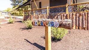 A wooden structure with a sign reading "Klimanjar".