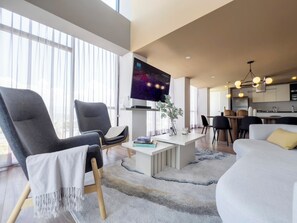 Luxury Apartment, Balcony, Mountain View | Living room | TV