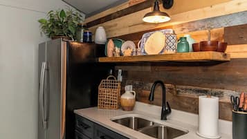 Fridge, oven, coffee/tea maker, cookware/dishes/utensils