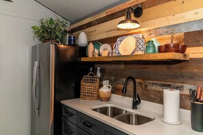 Fridge, oven, coffee/tea maker, cookware/dishes/utensils