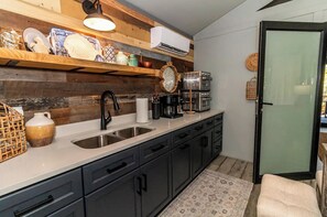 Fridge, oven, coffee/tea maker, cookware/dishes/utensils