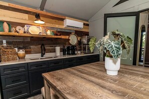 Fridge, oven, coffee/tea maker, cookware/dishes/utensils