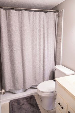 Jetted bath, hair dryer, towels, soap