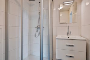 Shower, hair dryer, towels, toilet paper
