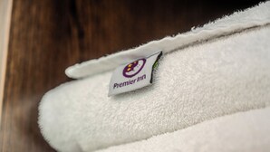 A white towel with a Premier Inn logo. - Premier Inn Lübeck City Centre (Lubeck)