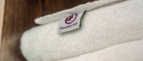 A white towel with a Premier Inn logo.