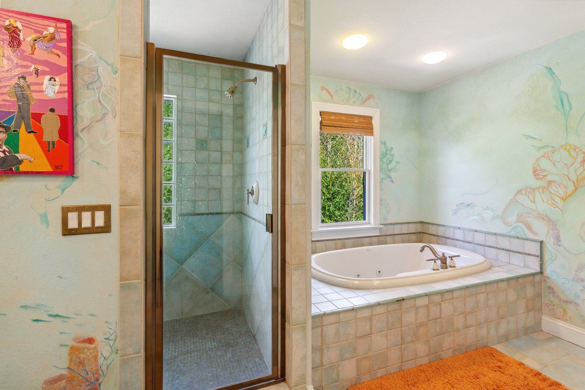 A bathroom with a walk-in shower, a bathtub, and a window with blinds.