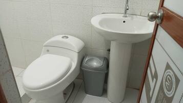 Shower, towels, soap, toilet paper