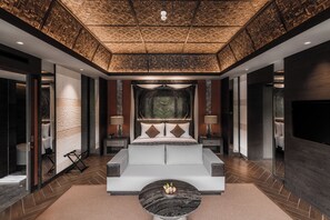 A modern hotel room with a large bed, bedside tables, a flat-screen TV, and a decorative ceiling. - Ayatara Resort Ubud  (Kerta)