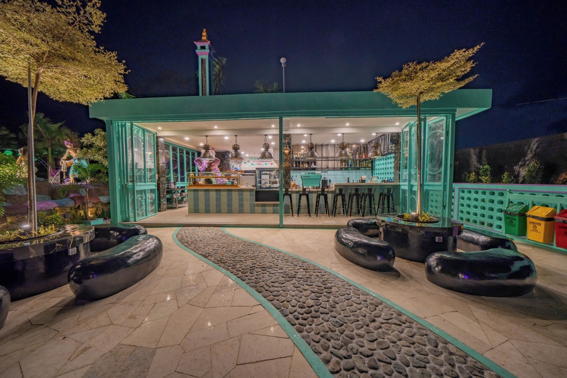 A restaurant with an open layout, featuring a bar area and seating.